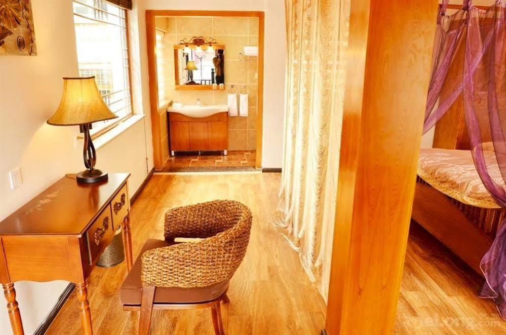 Готель Lijiang Overseas Club Екстер'єр фото