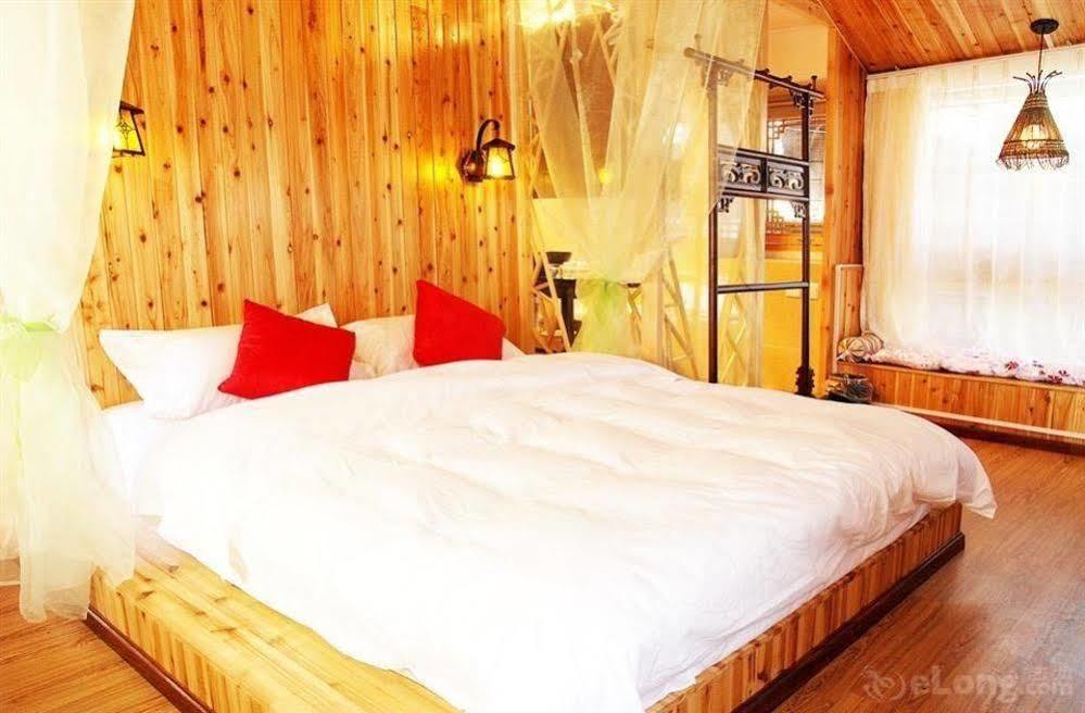 Готель Lijiang Overseas Club Екстер'єр фото